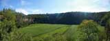 A view taking in one of the smaller craters, even thisone is madeuse of by the local farmers